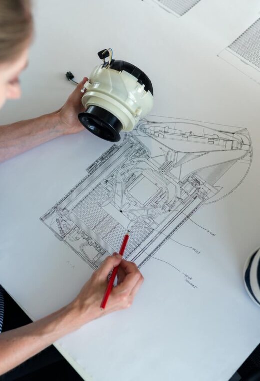 Two women who work in aerospace drawing a sketch
